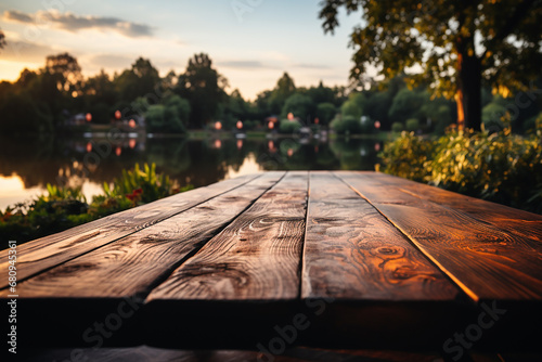 Empty wooden table top with blurred nature background. Calm sunny evening in nature with view to lake, river water and forest, park trees. AI