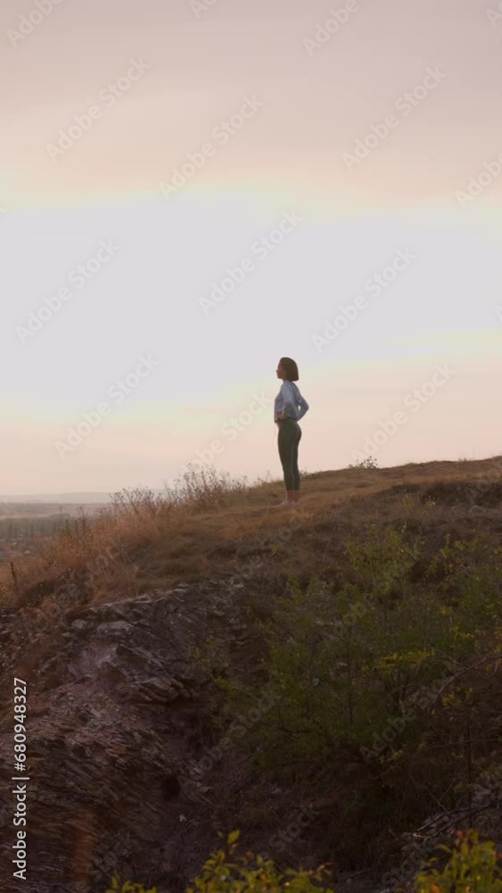 Sport woman running on sunny hill during the evening Sport woman running on sunny hill during the evening