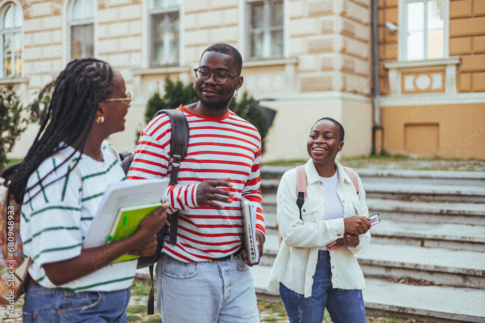 Group multiracial friends having fun outdoor. Youth millennial generation and multi ethnic teenagers lifestyle concept. Happy african college friends Group multiracial friends having fun outdoor. Youth millennial generation and multi ethnic teenagers lifestyle concept. Happy african college friends