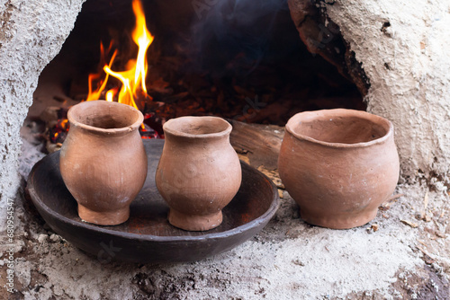Curing of Clay Pieces in a traditional oven © RonnyChee