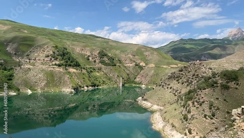 Turquoise lake Gizhgit in the village Bylym photo