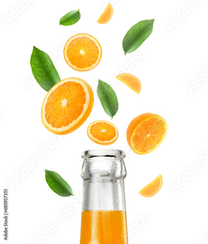 Orange juice bottle and Falling juicy oranges with green leaves isolated on transparent background. Flying defocusing slices of oranges. Applicable for fruit juice advertising. transparent background