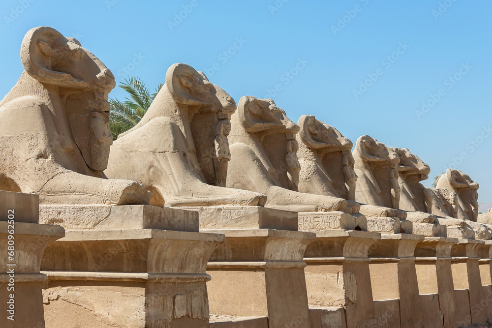 Karnak memorial complex. Avenue of sphinxes with rams' heads. The ruins