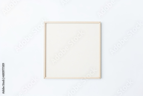 Thin square wooden frame in light beige on white background