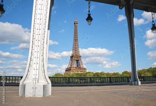 Eiffel tower in Paris during a sunny day .  Travel landmarks in Europe and France .