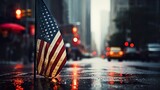 american flag on the street to celebrate independence day in the rain