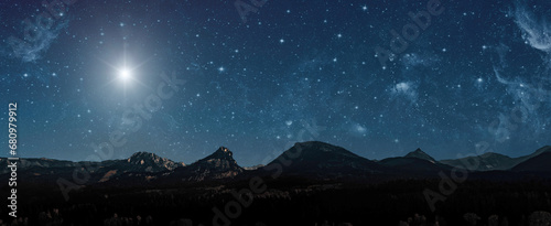 a Christmas star shines at night over the mountains of Bethlehem © vovan