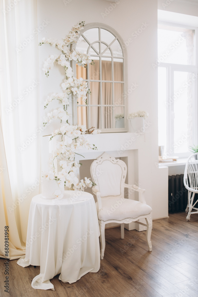 Elegant wedding dress, shoes and bouquet in room Elegant wedding dress, shoes and bouquet in room