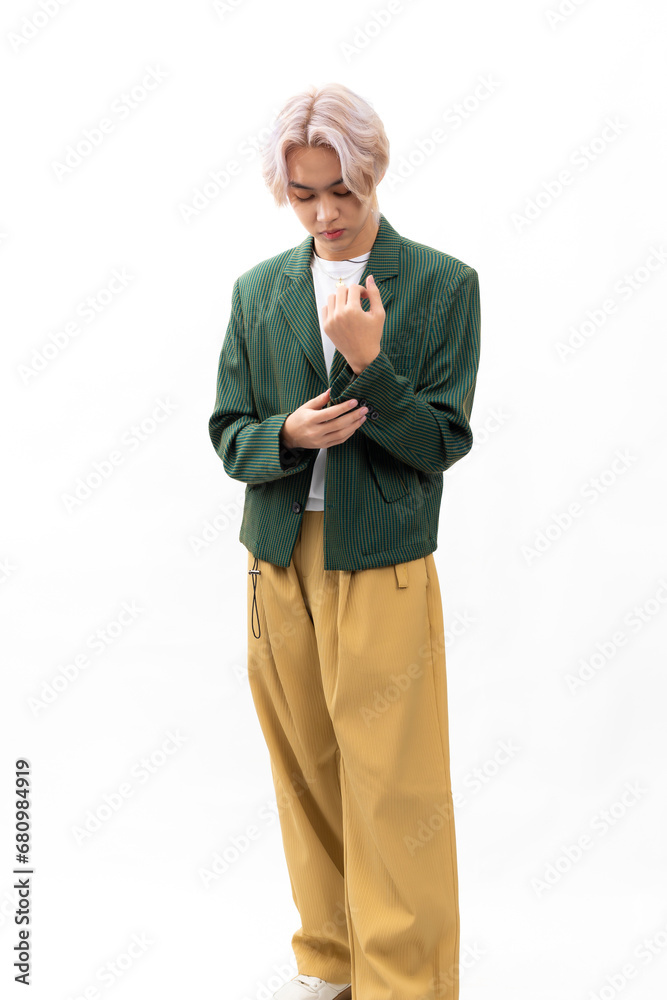 Green informal business suit. Fashion portrait Asian young man. model, clothing and cosmetics. Young male model fashion lifestyle in fashionable clothing isolated on white background Green informal business suit. Fashion portrait Asian young man. model, clothing and cosmetics. Young male model fashion lifestyle in fashionable clothing isolated on white background