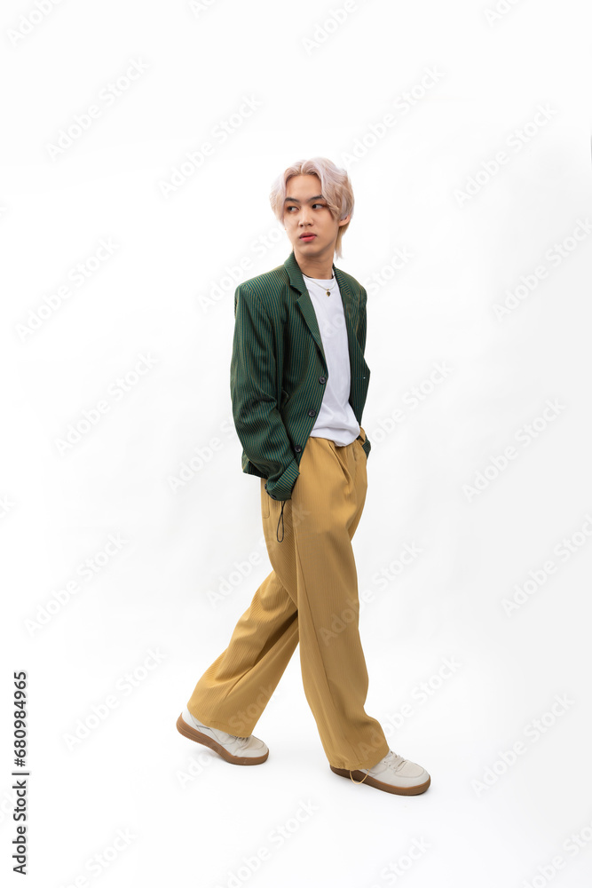 Green informal business suit. Fashion portrait Asian young man. model, clothing and cosmetics. Young male model fashion lifestyle in fashionable clothing isolated on white background Green informal business suit. Fashion portrait Asian young man. model, clothing and cosmetics. Young male model fashion lifestyle in fashionable clothing isolated on white background