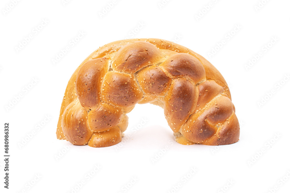 Half of a braided ring bread, isolated on white background, close up Half of a braided ring bread, isolated on white background, close up