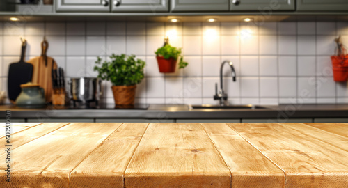 Wood table top on blur kitchen counter (room)background.For montage product display or design key visual layout.
