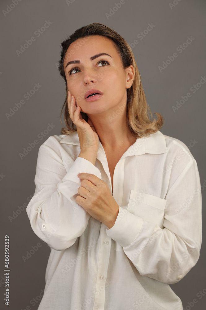 The woman is carefully focused, directing her gaze to one point. The woman is carefully focused, directing her gaze to one point.
