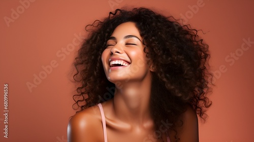 A portrait of a beautiful smiling happy African woman with her eyes closed. Red background
