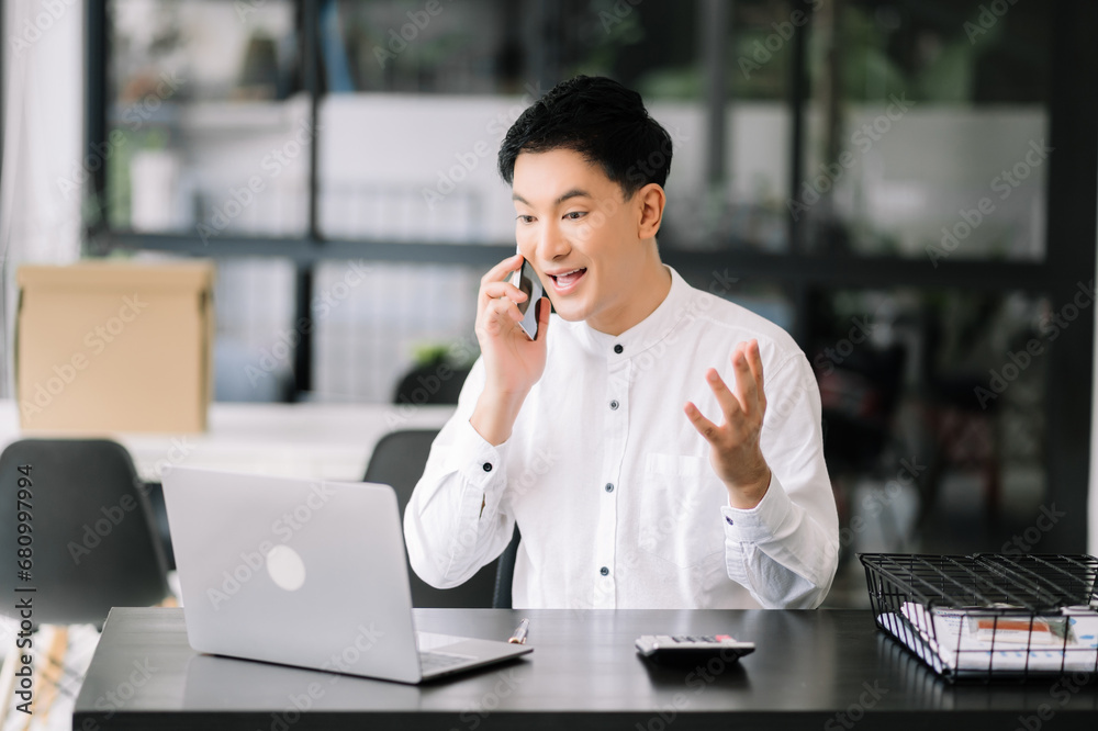 Business man using tablet and laptop for doing math finance on an office desk, tax, report Business man using tablet and laptop for doing math finance on an office desk, tax, report