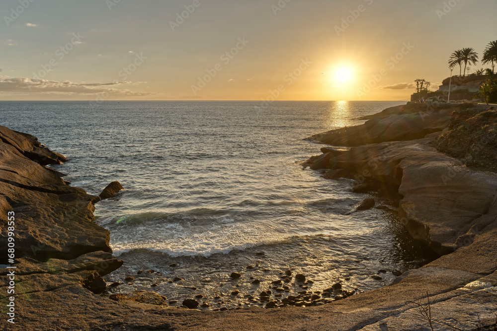 Atlantic oceanscape during sunset with waves and rocks, Tenerife island.