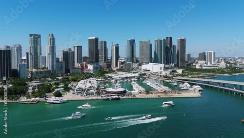 Unmatched waterfront aerial views with luxury yachts and sailboats in front of city skyline. Lovely Bayfront Park in Biscayne Boulevard near turquoise waters of Atlantic ocean photo