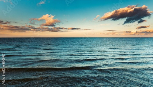 view of vast ocean horizon and sky at dusk photo