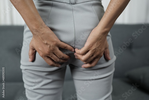Asian woman has itchy skin on her buttocks from a fungus.