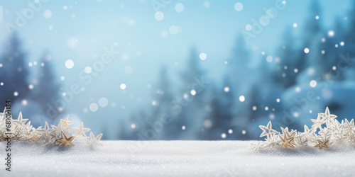 Frosted gold stars and pine trees under snowfall on icy blue background covered with white snow - Decoration for winter season, Christmas celebrations, New Year greeting card with copy space © mozZz