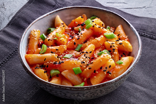 Tteokbokki or topokki, Korean street food, spicy rice cakes in red pepper gochujang sauce, a popular dish photo