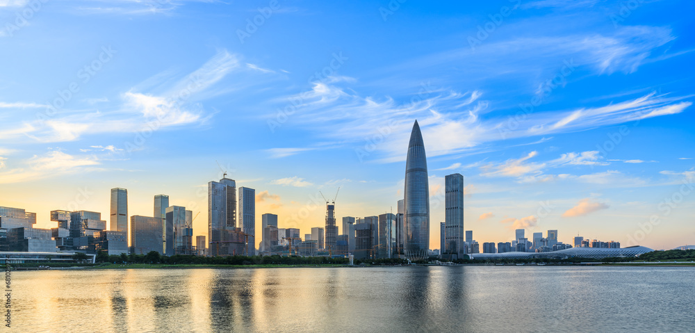 Fototapeta premium Shenzhen skyline and skyscrapers scenery at sunset, Guangdong Province, China. modern city buildings by the lake.