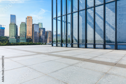 Empty square floor and city buildings background