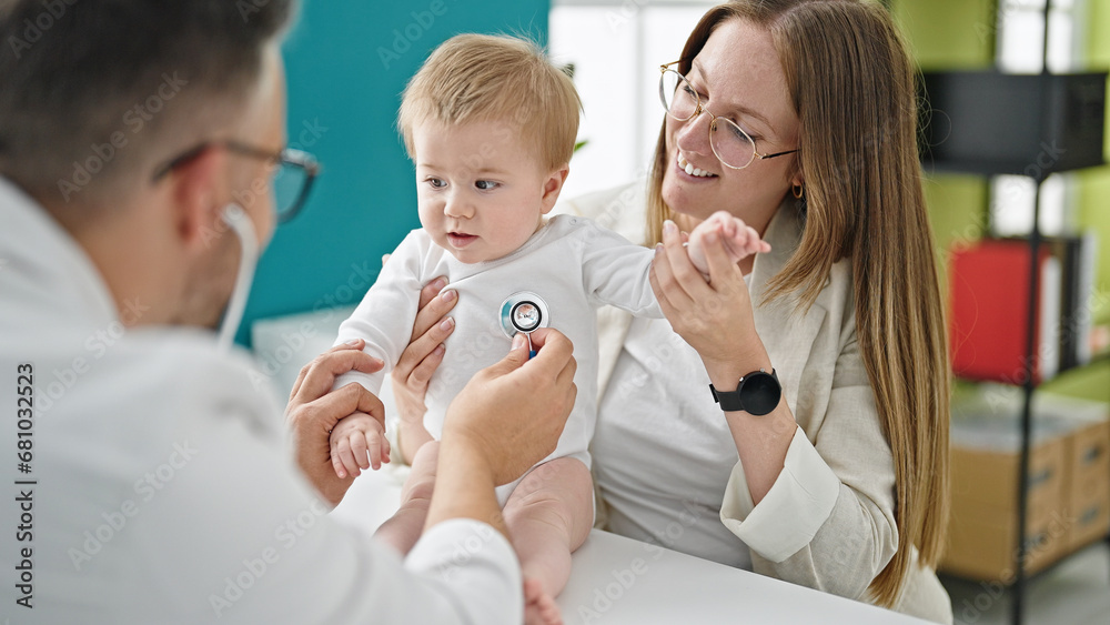 Caucasian mother with baby on a doctor appointment at clinic Caucasian mother with baby on a doctor appointment at clinic
