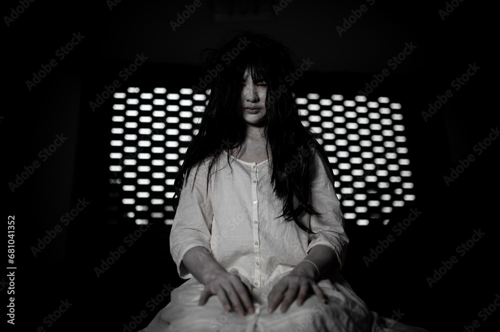 Portrait of asian woman make up ghost,Scary horror scene for background,Halloween festival concept,Ghost movies poster,angry spirit in the apartment