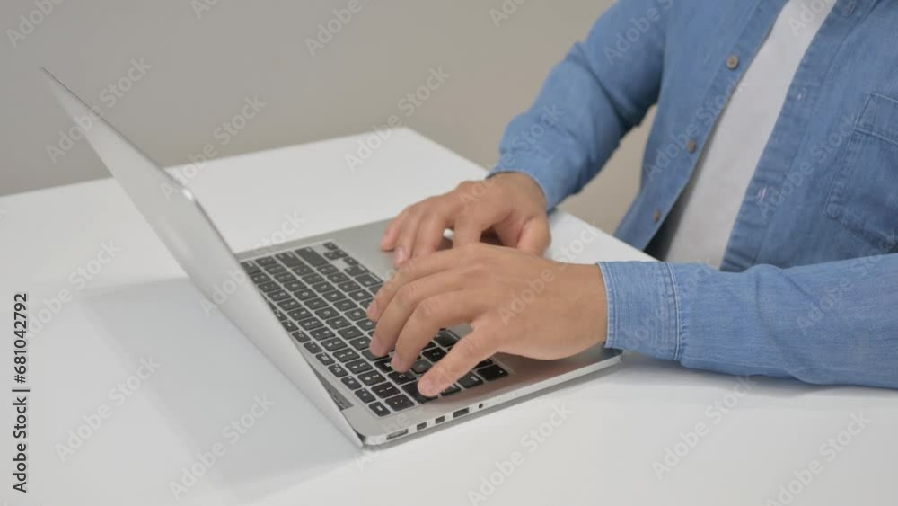 Close up of African Man Typing on Laptop Close up of African Man Typing on Laptop