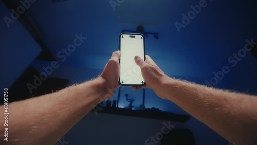 POV using smartphone in bed at night before sleep. Man turnoff mobile phone 