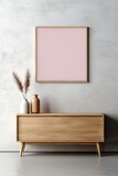 Scandinavian-inspired wooden cabinet and dresser harmonizing with the cool tones of a concrete wall. A blank mock-up poster frame invites personalized artwork, completing the modern home interior.
