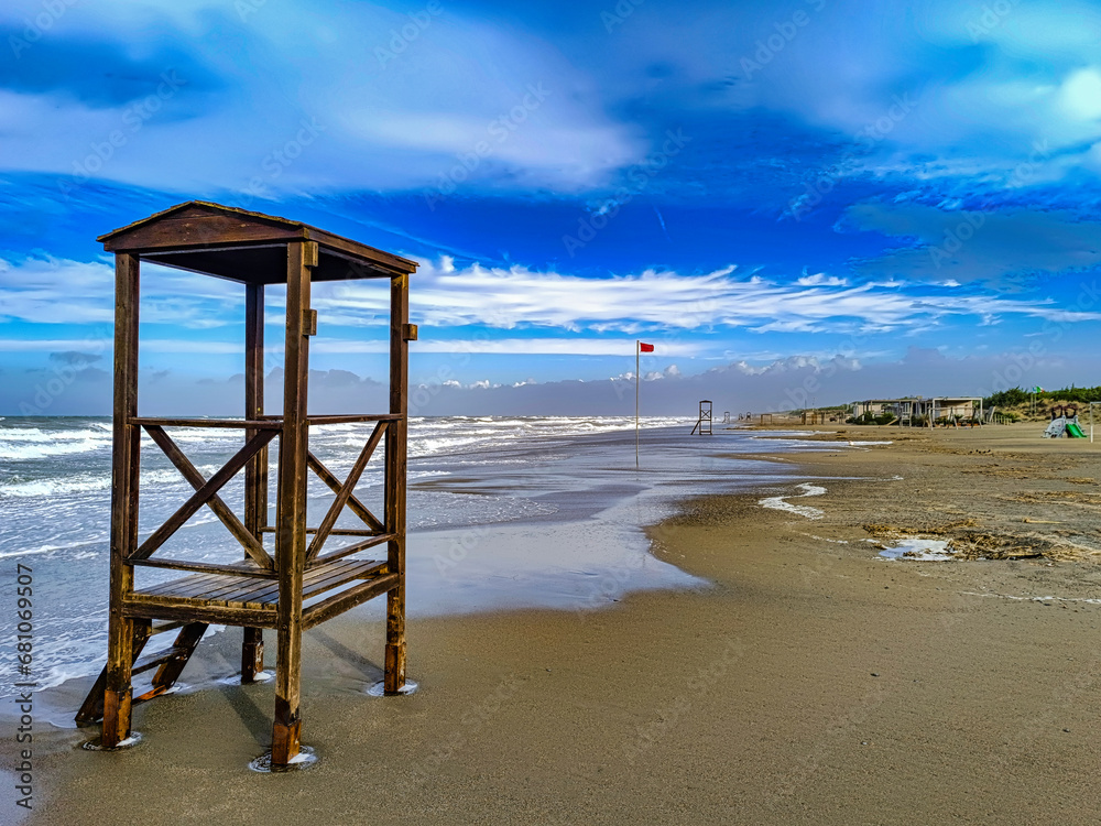 In the foreground lifeguard station used in summer on the beach of Marina di Castagneto Carducci Livorno Tuscany Italy