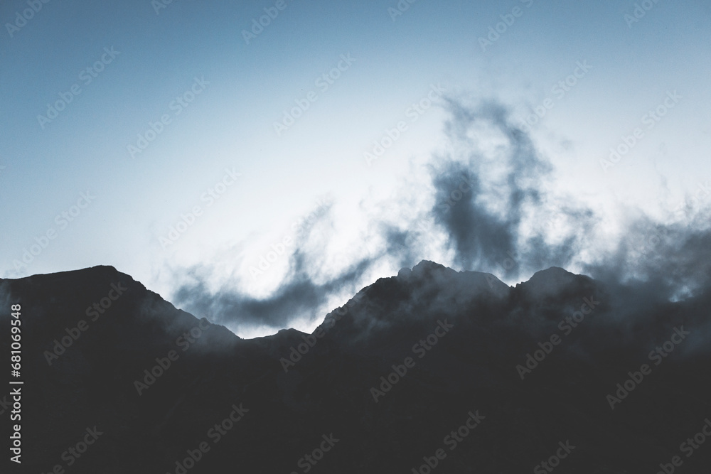clouds over the mountains at blue hour