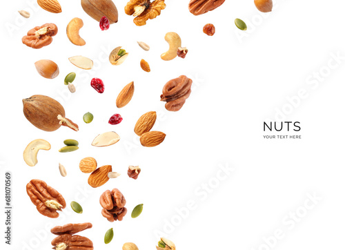 Creative layout made of nuts on the white background. Flat lay. Food concept. Macro concept. Pecan, walnut, hazelnut, cashew, almonds, pumpkin seeds, sunflower seeds on the white background. photo
