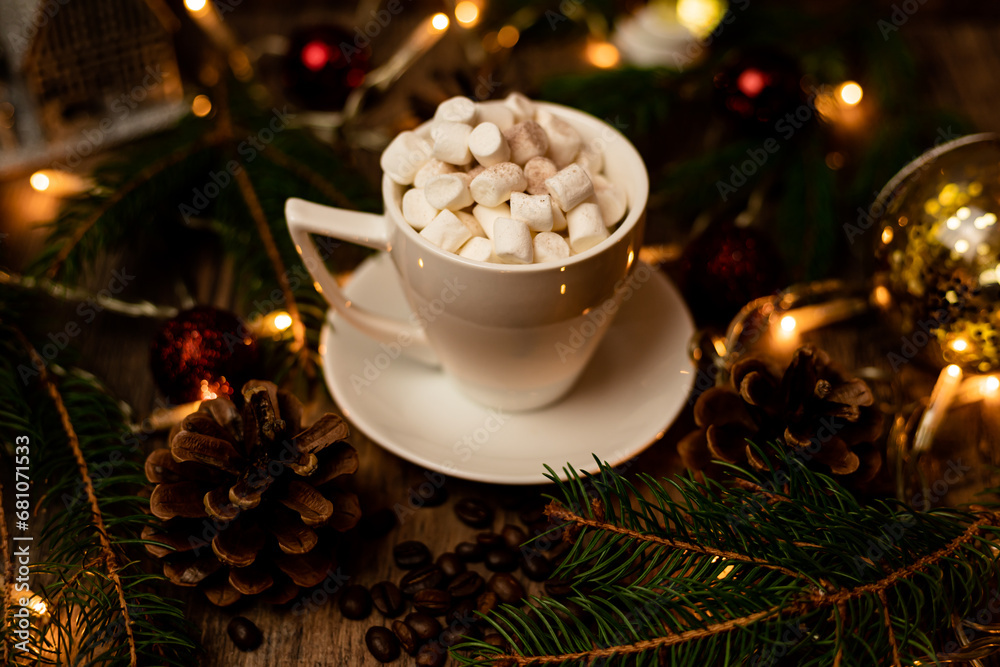 Marshmelon in a white cup on a table with Christmas lights. Christmas tree Marshmelon in a white cup on a table with Christmas lights. Christmas tree