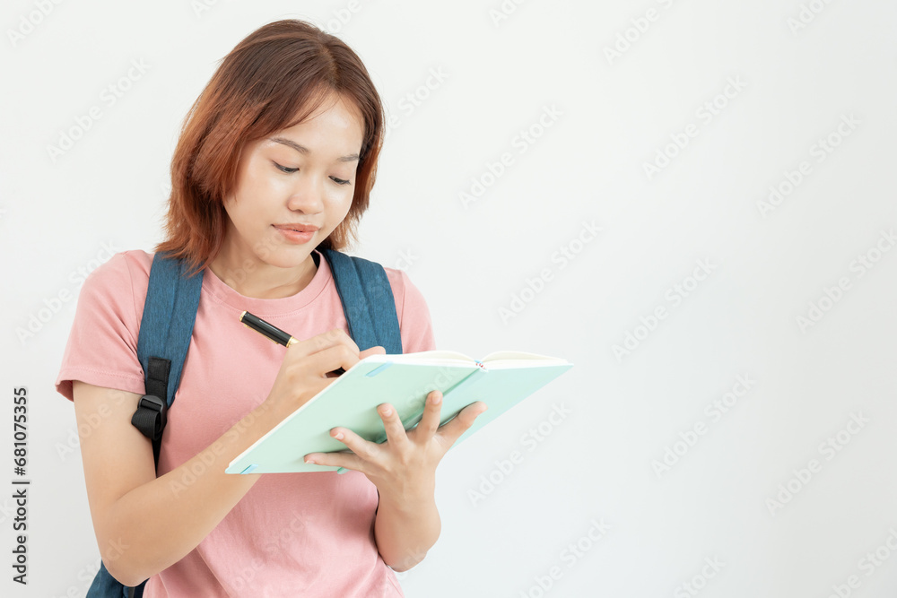 Portrait beautiful Asian woman student. Smile girl happy study. read book in college campus. young female on international Asia University. Education, study, school, learning, exam, continue education Portrait beautiful Asian woman student. Smile girl happy study. read book in college campus. young female on international Asia University. Education, study, school, learning, exam, continue education