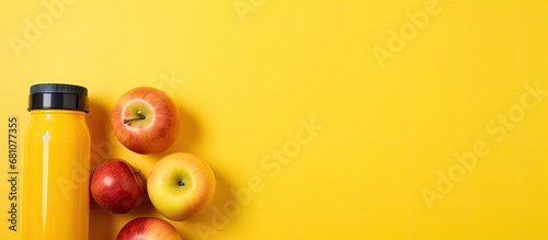 Promoting healthy snacks for school with food water apple and school supplies on yellow background Copy space image Place for adding text or design