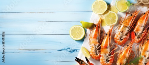 Seafood platter with langoustines grilled shrimp skewers citrus slices and a bright beach setting Copy space image Place for adding text or design