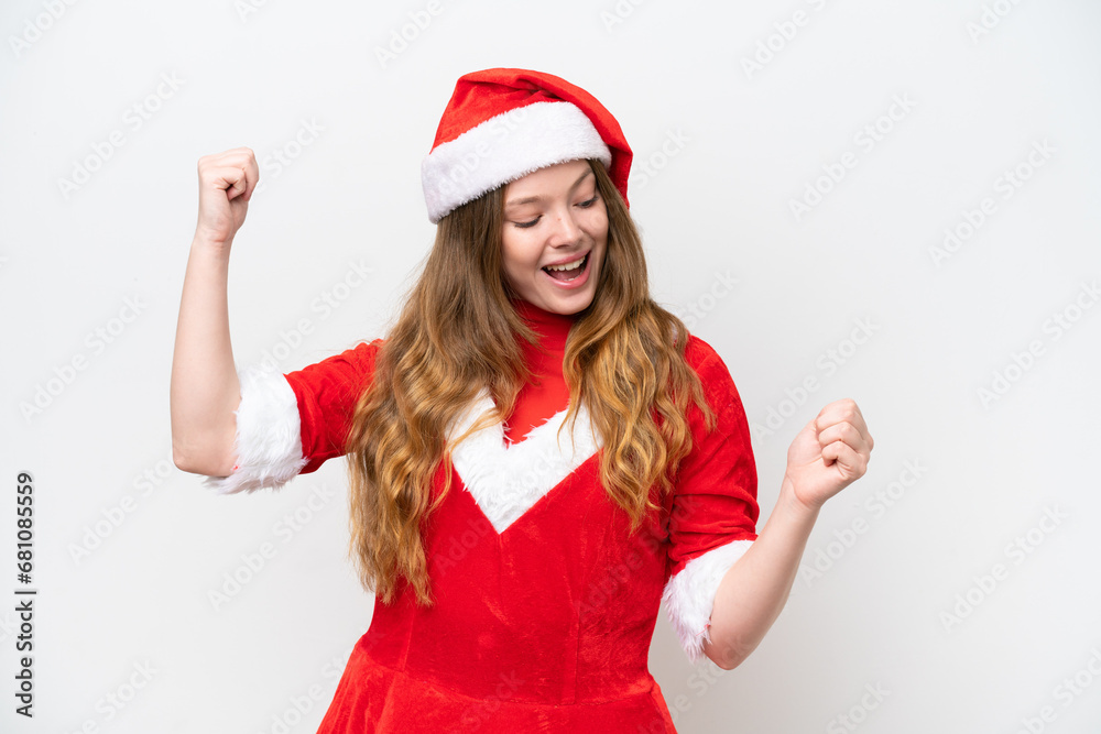 Young caucasian woman with Christmas dress isolated on white background celebrating a victory Young caucasian woman with Christmas dress isolated on white background celebrating a victory