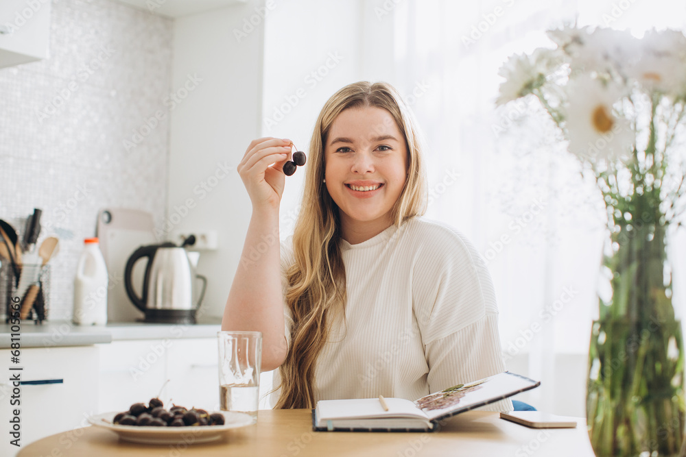 Young beautiful female student at home doing creative journal. Young beautiful female student at home doing creative journal.