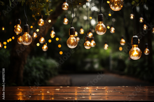 Party lights hanging on trees in garden background photo