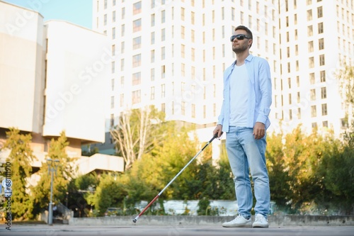 Blind man with a walking stick.