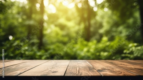 Close up top wooden table with green forest in the background, sunny day.