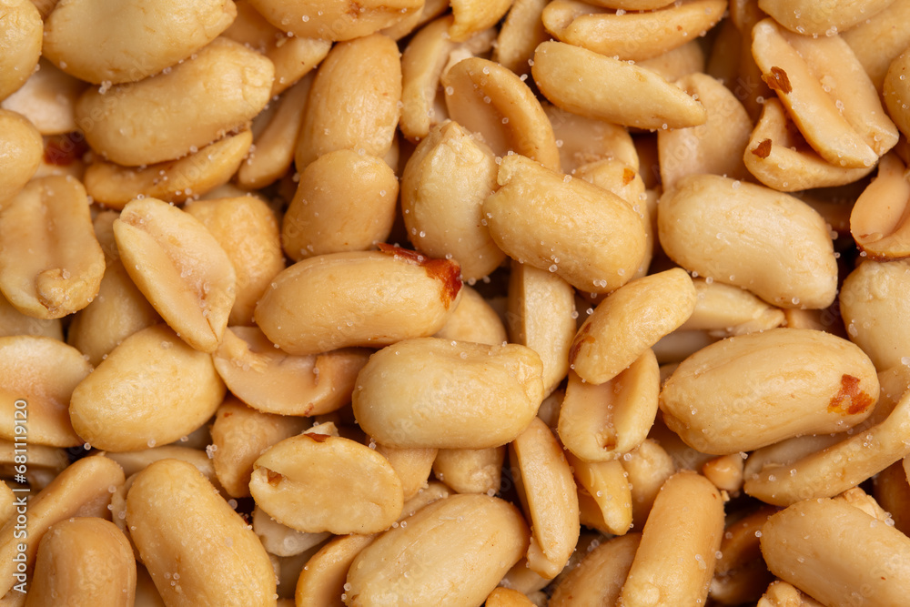 Peanuts look delicious. Close-up of peeled, roasted, salted peanuts background. Peanuts look delicious. Close-up of peeled, roasted, salted peanuts background.