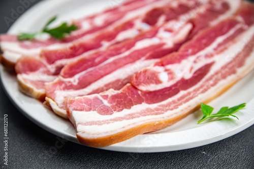 bacon slice fresh meat pork eating appetizer meal food snack on the table copy space food background rustic top view