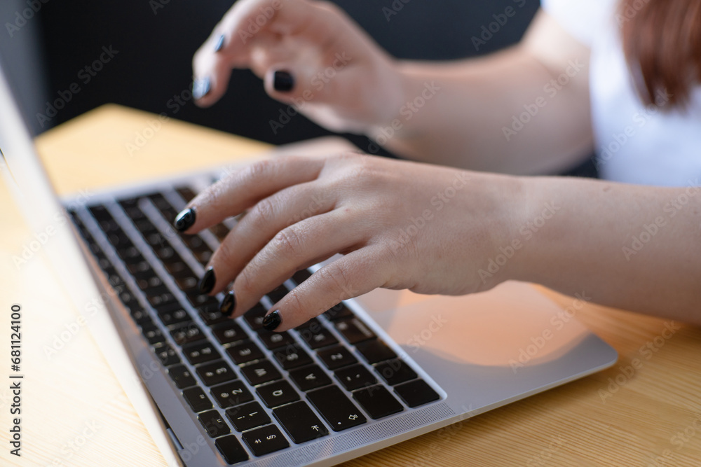 Work on the kitchen office. Remote work from home office. Young woman using laptop. Freelancer workplace at kitchen table. Distance education Work on the kitchen office. Remote work from home office. Young woman using laptop. Freelancer workplace at kitchen table. Distance education