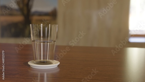  Water Glass Placed On A Wooden Table  (ID: 681125179)
