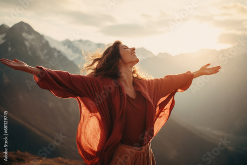 A woman enjoying the fresh air in the mountains