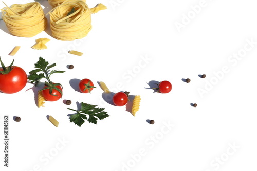 Fototapeta Naklejka Na Ścianę i Meble -  Three spaghetti in the form of a nest with vegetables and spices lie on a white background.